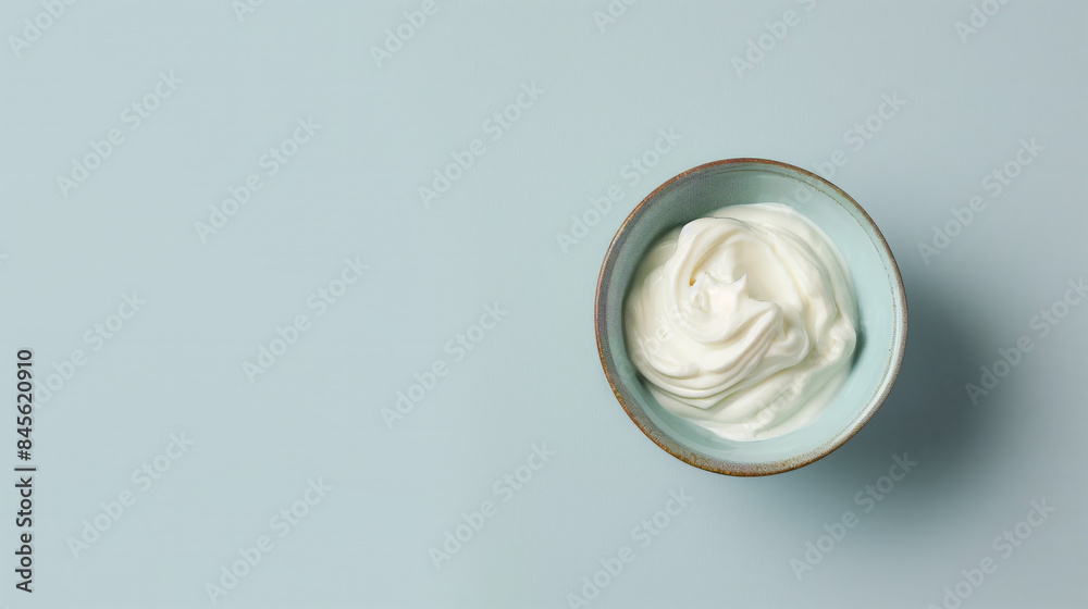 Top View of a Bowl of Sour Cream or Greek Yogurt on a White Background
Top View of a Bowl of Sour Cream or Greek Yogurt on a White Background