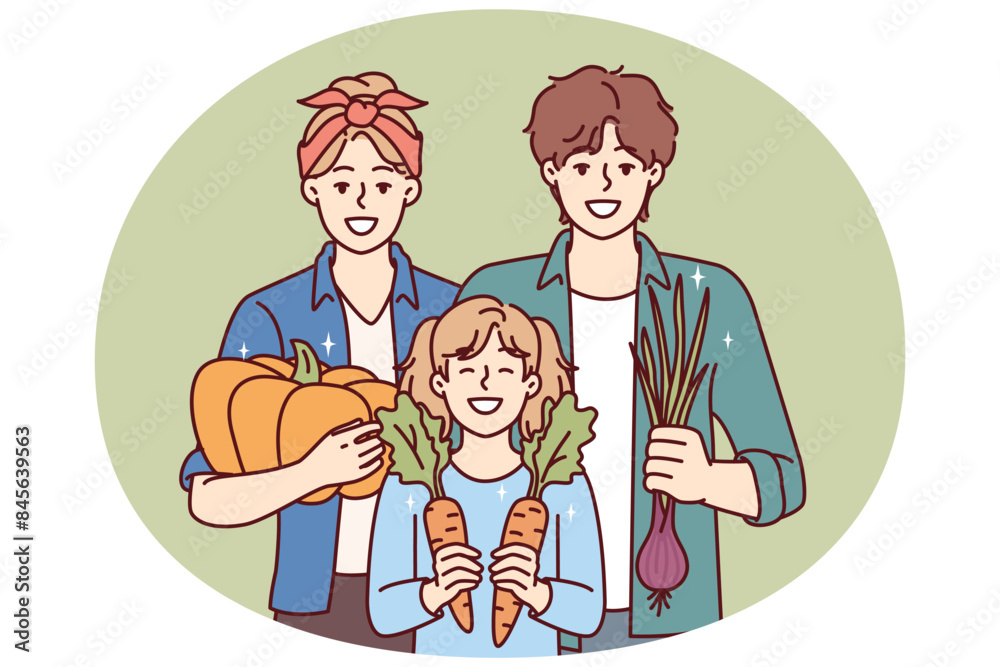 Gardening family posing with organic vegetables grown on own farm and rejoice in good harvest. Happy parents together with daughter are engaged in family business growing vegetables Gardening family posing with organic vegetables grown on own farm and rejoice in good harvest. Happy parents together with daughter are engaged in family business growing vegetables