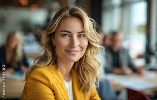 Smiling Woman In Yellow Blazer At A Coffee Shop
