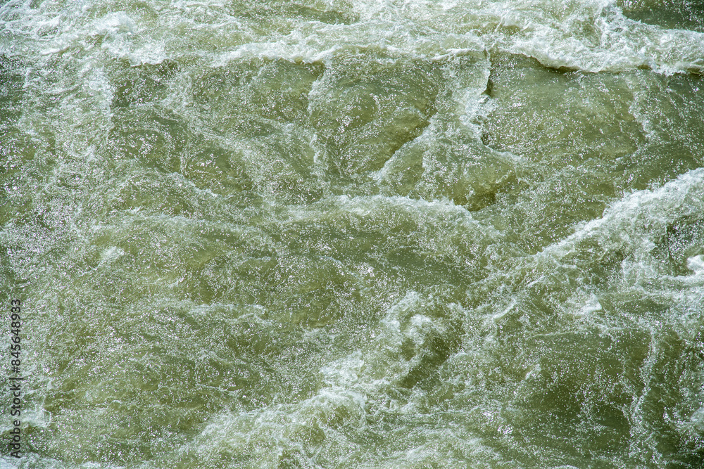 Fast water stream with wave, top view background. Abstract nature patterns Fast water stream with wave, top view background. Abstract nature patterns