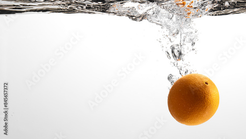 Fresh fruit falling into the water. Organic fruits for making effective juices for dieting.