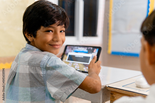 Canvastavla Portrait of Elementary Hispanic school Kids using tablet computers in class