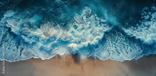 Aerial View of Ocean Waves Crashing on Sandy Beach