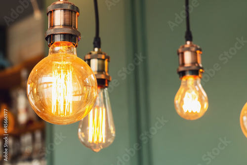 A vintage lamp hangs on the ceiling and glows.