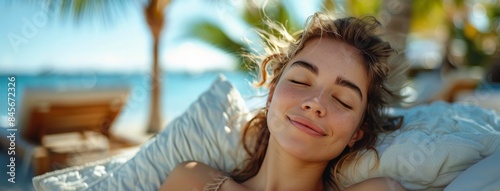 Woman Relaxing on Beach Lounger With Ocean View and Palm Trees