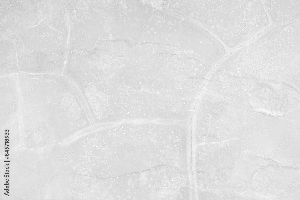 Naklejka premium Empty cracked grey stone wall on cave for abstract background and texture. beautiful patterns, space for work, banner, seamless wallpaper close up.