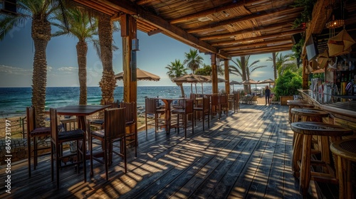 Cozy wooden deck with tables and chairs on the beach  perfect for casual gatherings or relaxation