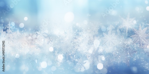 A delicate pattern of various snowflakes in white, set against a light blue or dark blue background, creating a clean and elegant winter theme
