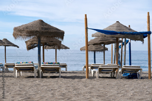 umbrellas and hammocks on the sand of the beach