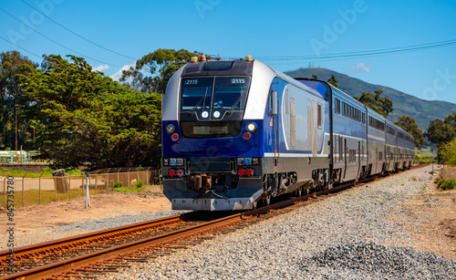 Photography Passenger train with diesel engine and coaches arriving in Carpinteria, California (USA)