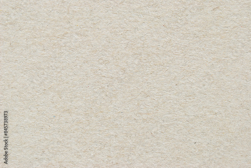 A sheet of beige recycled cardboard texture as background