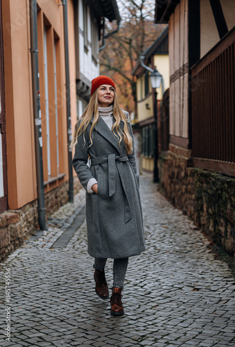 a young girl walks through the old cities of Europe #845745556