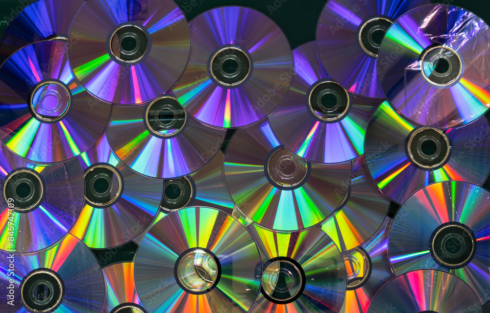 A collection of CDs with a rainbow effect A collection of CDs with a rainbow effect
