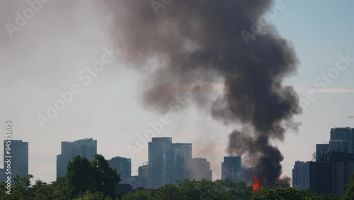 4K footage of a fire burning in a large metropolitan city. Cinematic shots capturing the intense flames and urban environment.