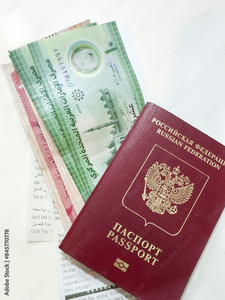Russian passport and Arab Emirates Banknotes Russian passport and Arab Emirates Banknotes