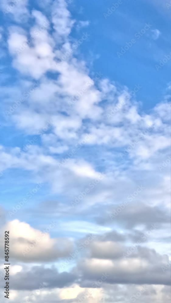 The video shows nature’s canvas, tranquil blue skies with cotton-like clouds, great for meditation visuals. The video shows nature’s canvas, tranquil blue skies with cotton-like clouds, great for meditation visuals.