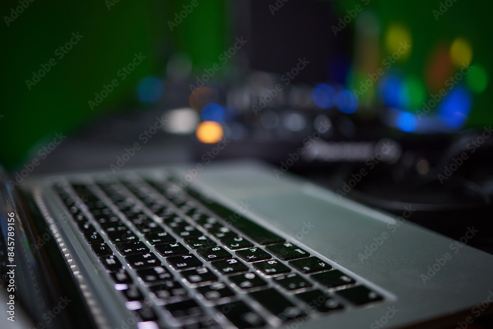 A closeup showing hands typing on a laptop keyboard, with an engagement ring on the finger A closeup showing hands typing on a laptop keyboard, with an engagement ring on the finger