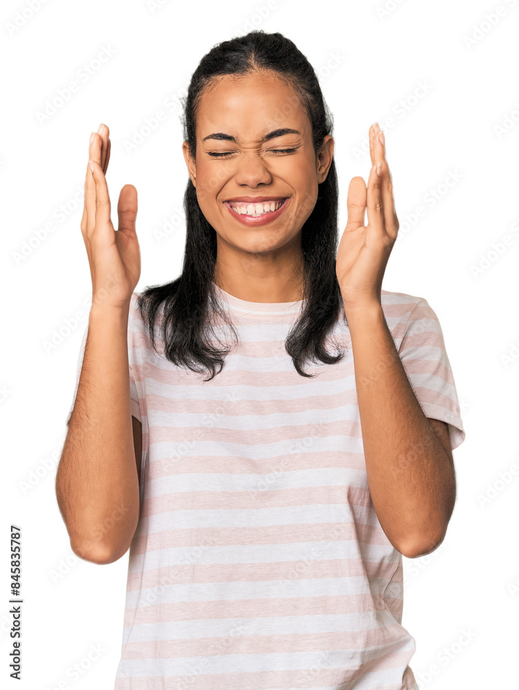 Young Filipina woman joyful laughing a lot. Happiness concept. Young Filipina woman joyful laughing a lot. Happiness concept.