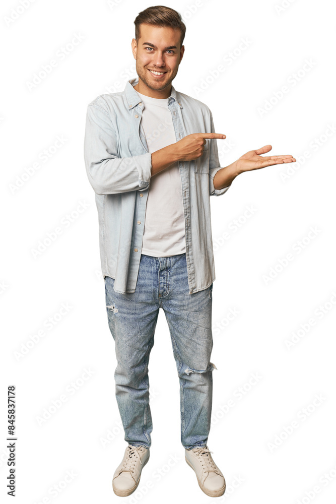 Full body portrait of a man in studio excited holding a copy space on palm. Full body portrait of a man in studio excited holding a copy space on palm.