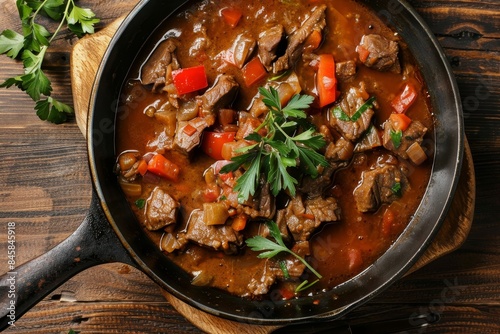 Top down look at pan of Zurich ragout Meat sliced traditional German dish