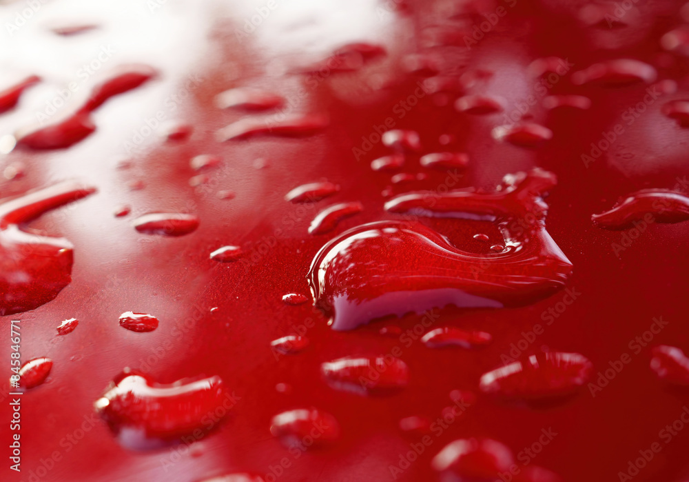Fototapeta premium water drops on red surface