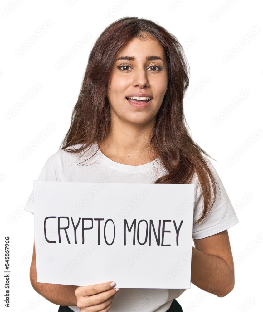 Middle Eastern woman with crypto sign laughs out loudly keeping hand on chest. Middle Eastern woman with crypto sign laughs out loudly keeping hand on chest.