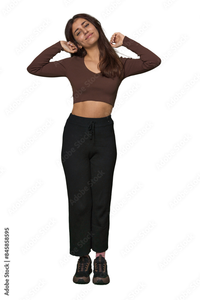 Middle Eastern woman, full body studio stretching arms, relaxed position. Middle Eastern woman, full body studio stretching arms, relaxed position.