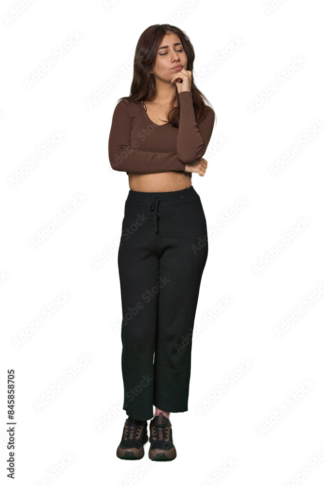 Middle Eastern woman, full body studio thinking and looking up, being reflective, contemplating, having a fantasy. Middle Eastern woman, full body studio thinking and looking up, being reflective, contemplating, having a fantasy.