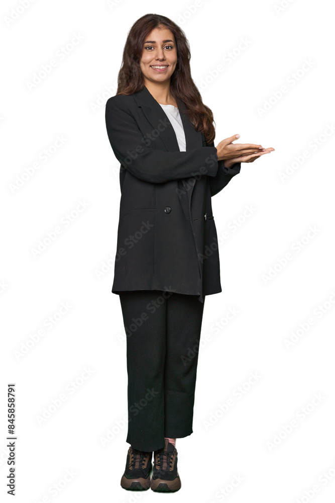 Middle Eastern in business attire holding a copy space on a palm. Middle Eastern in business attire holding a copy space on a palm.