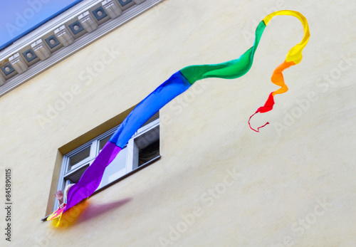 copy space on house with rainbow flag in window