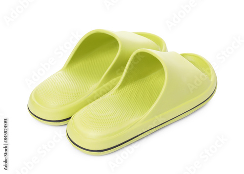 Pair of green rubber slippers isolated on white