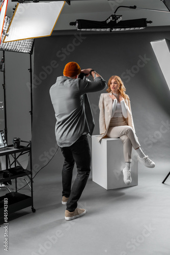 Photographer and fashion model in studio for creative art, clothes brand and designer social media blog photo