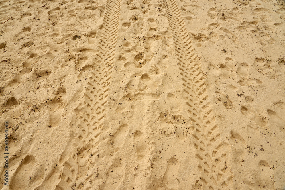 Traces of people and vehicles in the sand. Traces of people and vehicles in the sand.