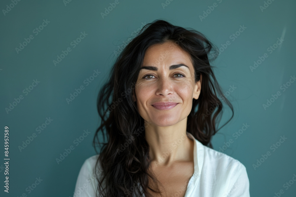 A close up portrait of a woman with a subtle smile A close up portrait of a woman with a subtle smile