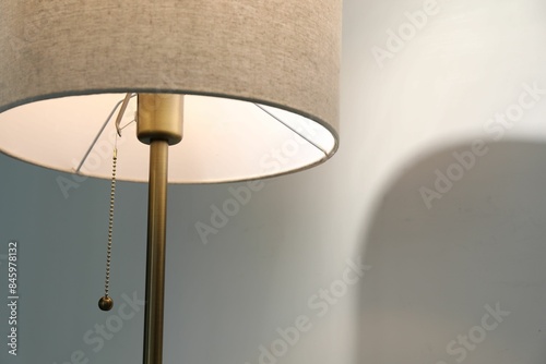 Wallpaper Mural Stylish lamp near light wall, closeup. Space for text Torontodigital.ca