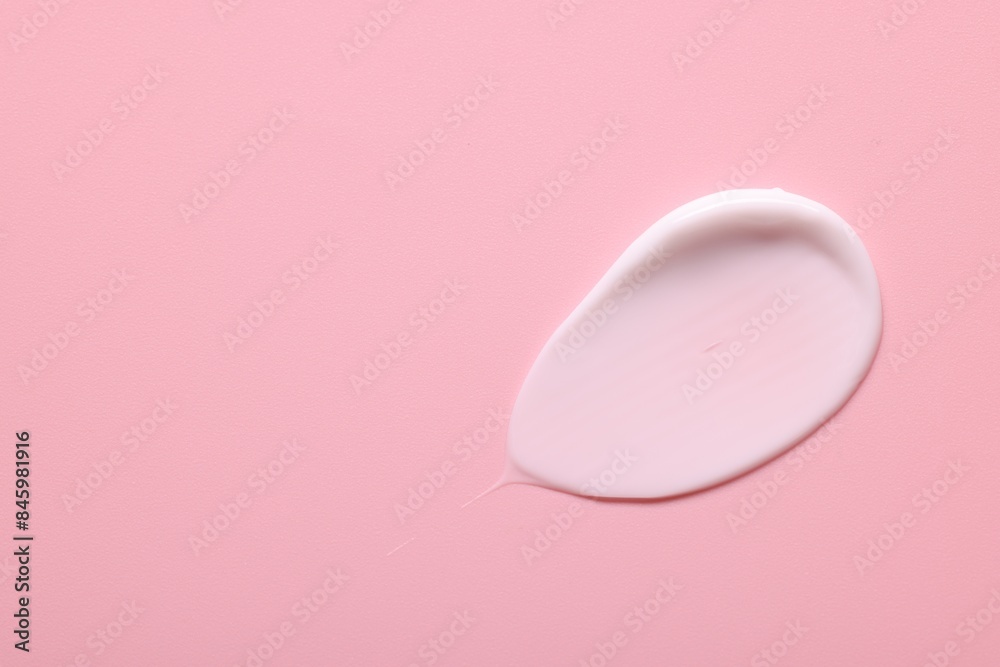 Sample of face cream on pink background, top view. Space for text Sample of face cream on pink background, top view. Space for text