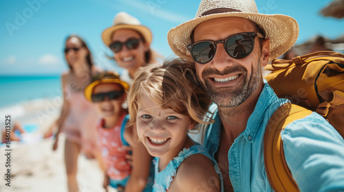 Creating Memories: Dad Takes Selfie with Family on Summer Beach Trip