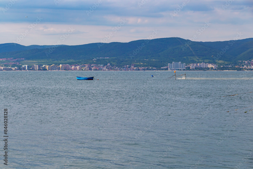 Obraz premium A blue fishing boat in the Black Sea near a dalyan, fixed sea fishing gear near the port of Old Town Nesebar, Burgas Province, Bulgaria