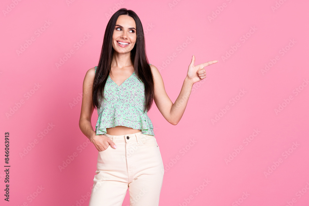 Photo of cute pretty glamour woman wear stylish clothes recommend empty space isolated on pink color background Photo of cute pretty glamour woman wear stylish clothes recommend empty space isolated on pink color background