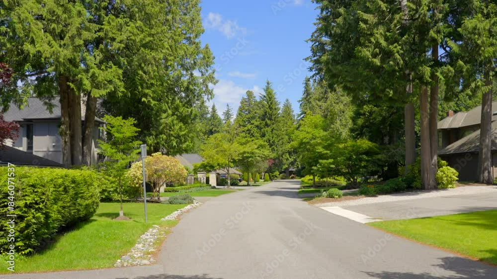 Establishing shot of luxury house with big tree and nice spring blossom landscape in Vancouver, Canada, North America. Day time on June 2024. ProRes 422 HQ. Establishing shot of luxury house with big tree and nice spring blossom landscape in Vancouver, Canada, North America. Day time on June 2024. ProRes 422 HQ.