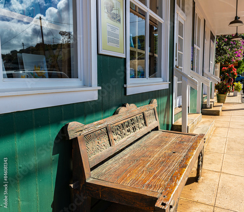 Hand Carved Wooden Bench and Historic Storefront in Old Hanapepe Town, Kauai, Hawaii, USA photo