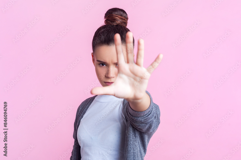 Staching Rular Girl Portrait of serious strict teenage girl with bun hairstyle in casual ...