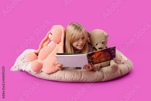 Cute little girl with plush...