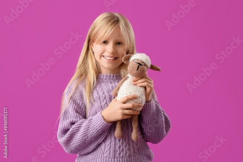 Cute little girl with plush...