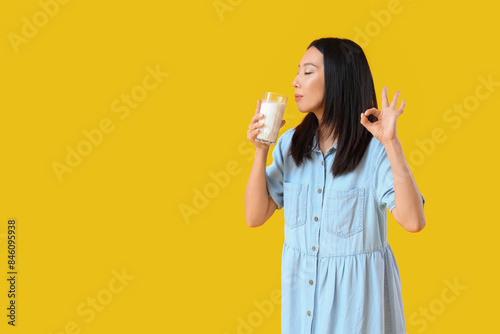 Young Asian woman with glas...
