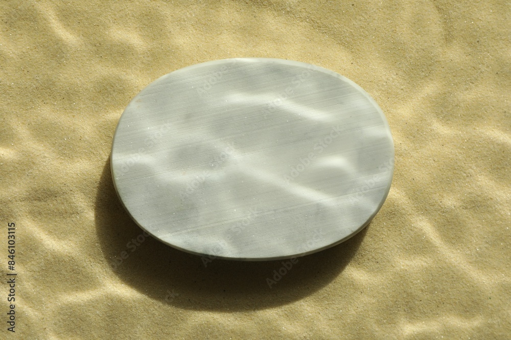 Obraz premium Stylish presentation for product. Stone podium on sand, top view