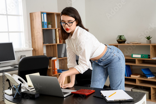 Young businesswoman working...