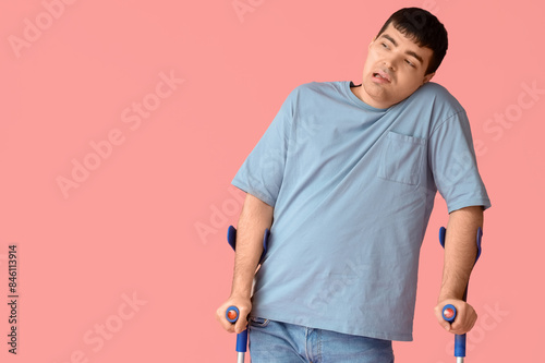 Young man with crutches on ...
