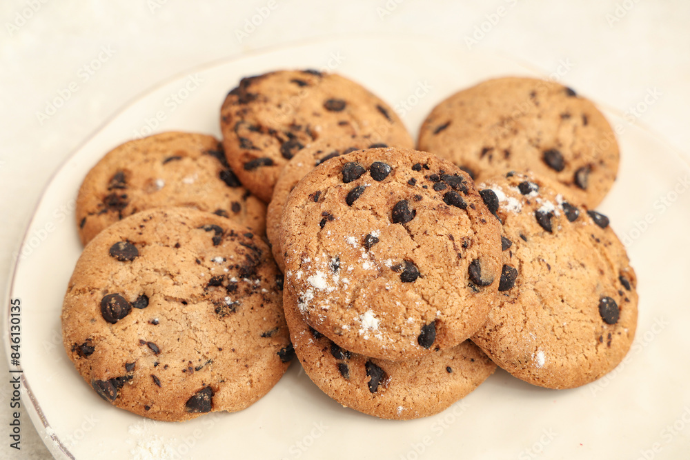 Plate of sweet cookies with chocolate chips on white background, closeup Plate of sweet cookies with chocolate chips on white background, closeup