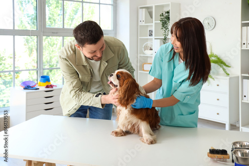 Female Asian veterinarian w...
